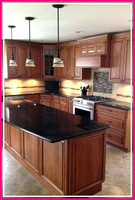 black stainless steel appliances with light oak cabinets|two tone oak kitchen cabinets.